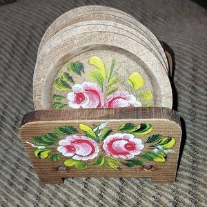 Vintage hand-painted wooden coasters with a matching stand, In A floral design. 
